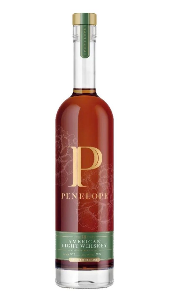 A bottle of Penelope American Light Whiskey with a gold cap, green label, and floral design, stating it is aged 18 years and a limited release.